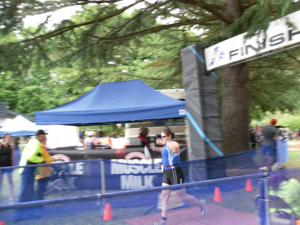 Crossing the finish line at my first official triathlon!