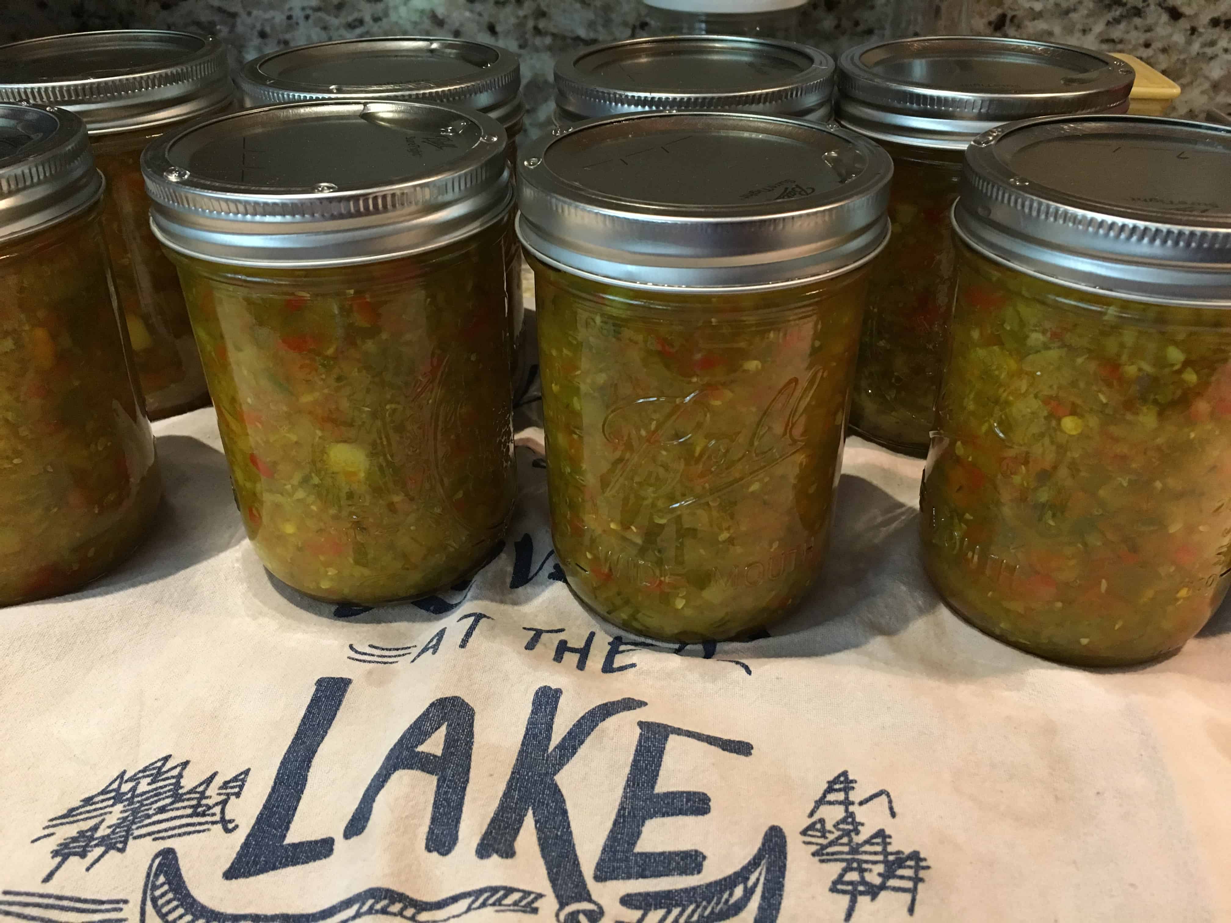 Home-canned pickle relish cooling on a tea towel. https://trimazing.com