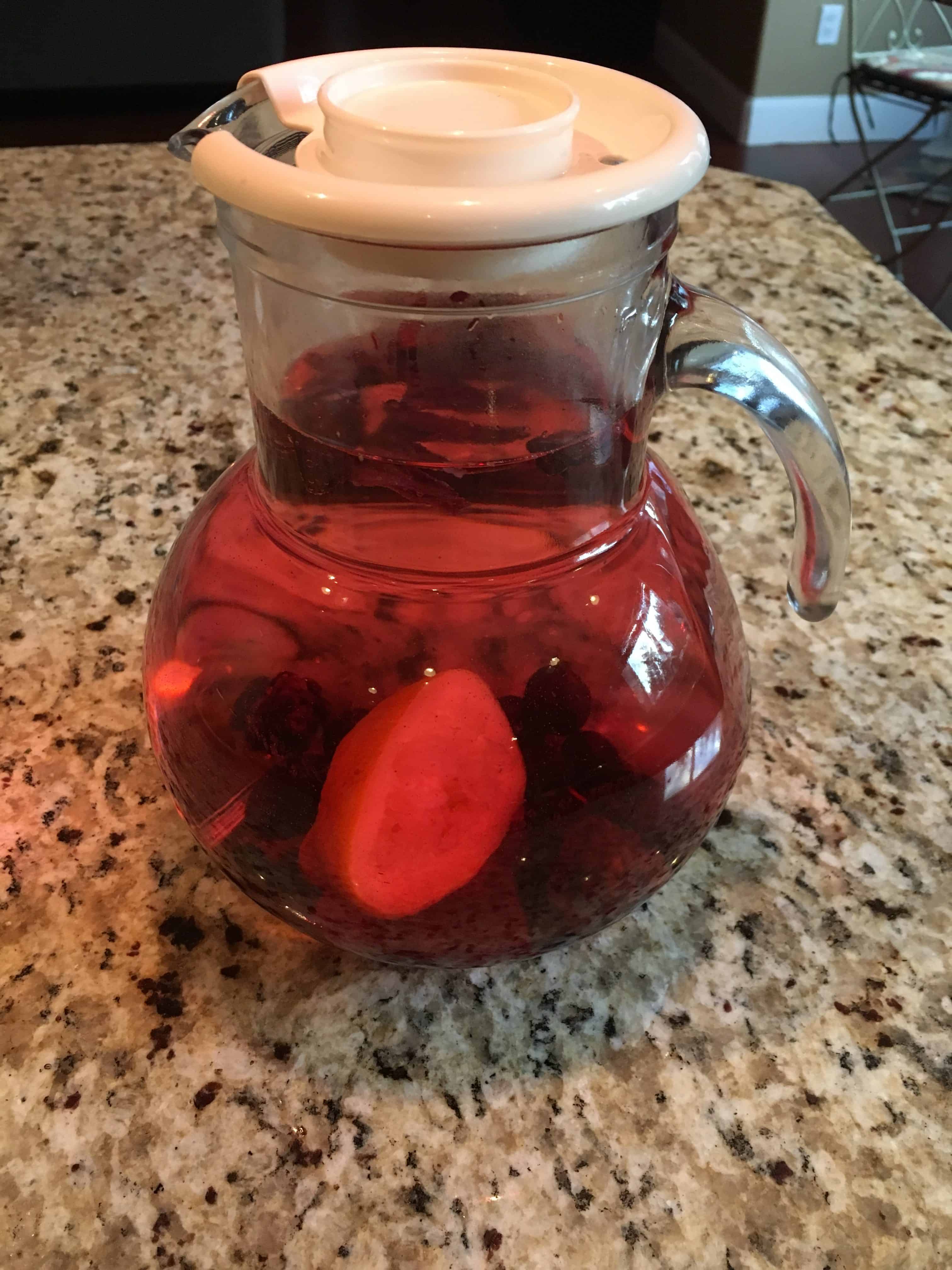 Pitcher of Water Infused with hibiscus flowers, lemons, and berries. https://trimazing.com/ 