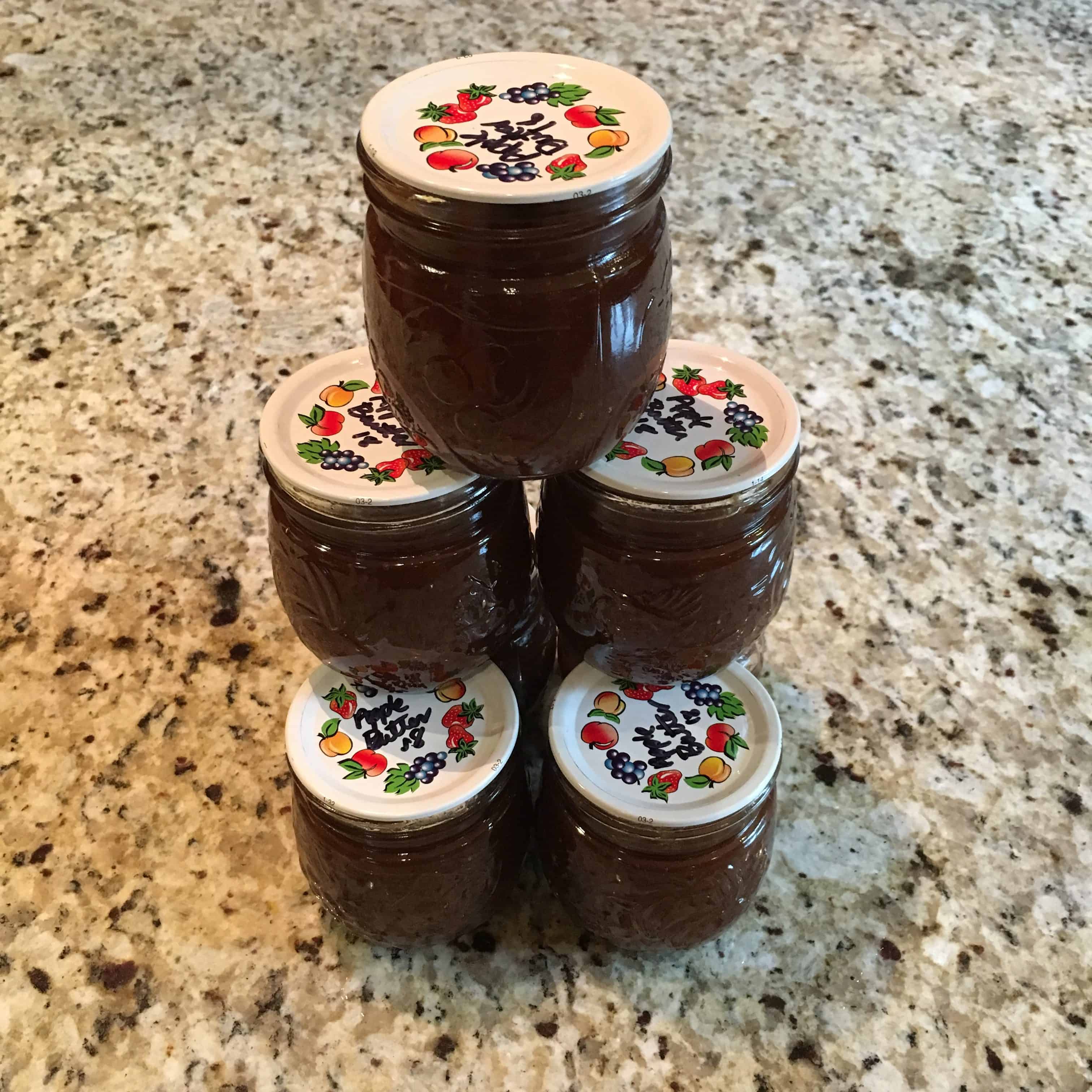 Stack of home canned apple butter. https://trimazing.com