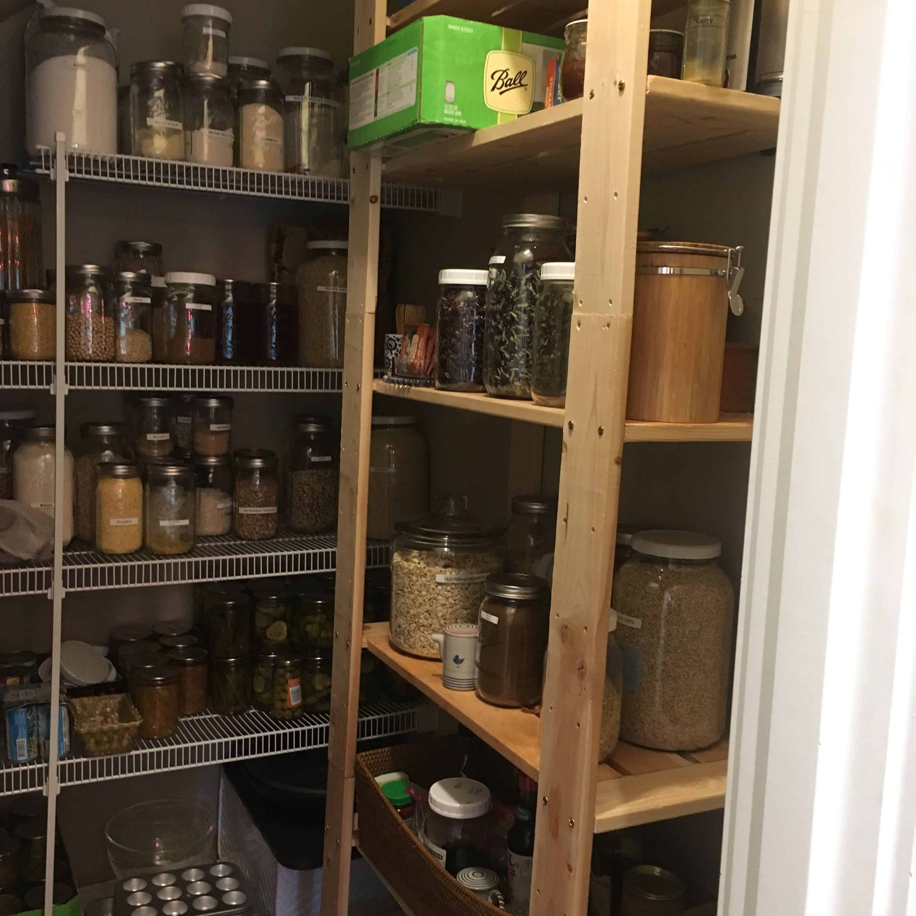 Walk-in pantry with shelves of glass storage jars full of vegan (whole food plant-based) foods https://trimazing.com