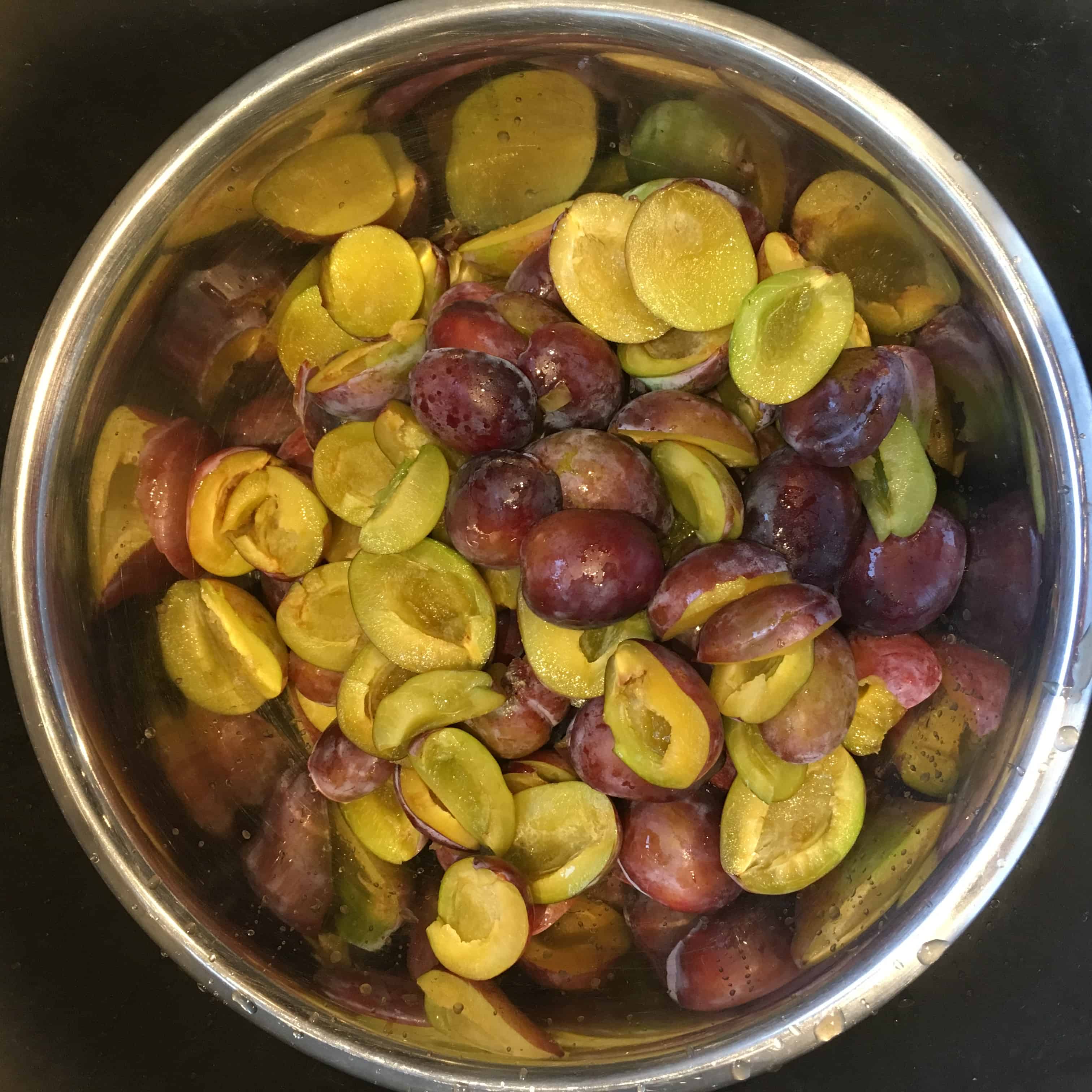 Halved Italian plums. https://trimazing.com
