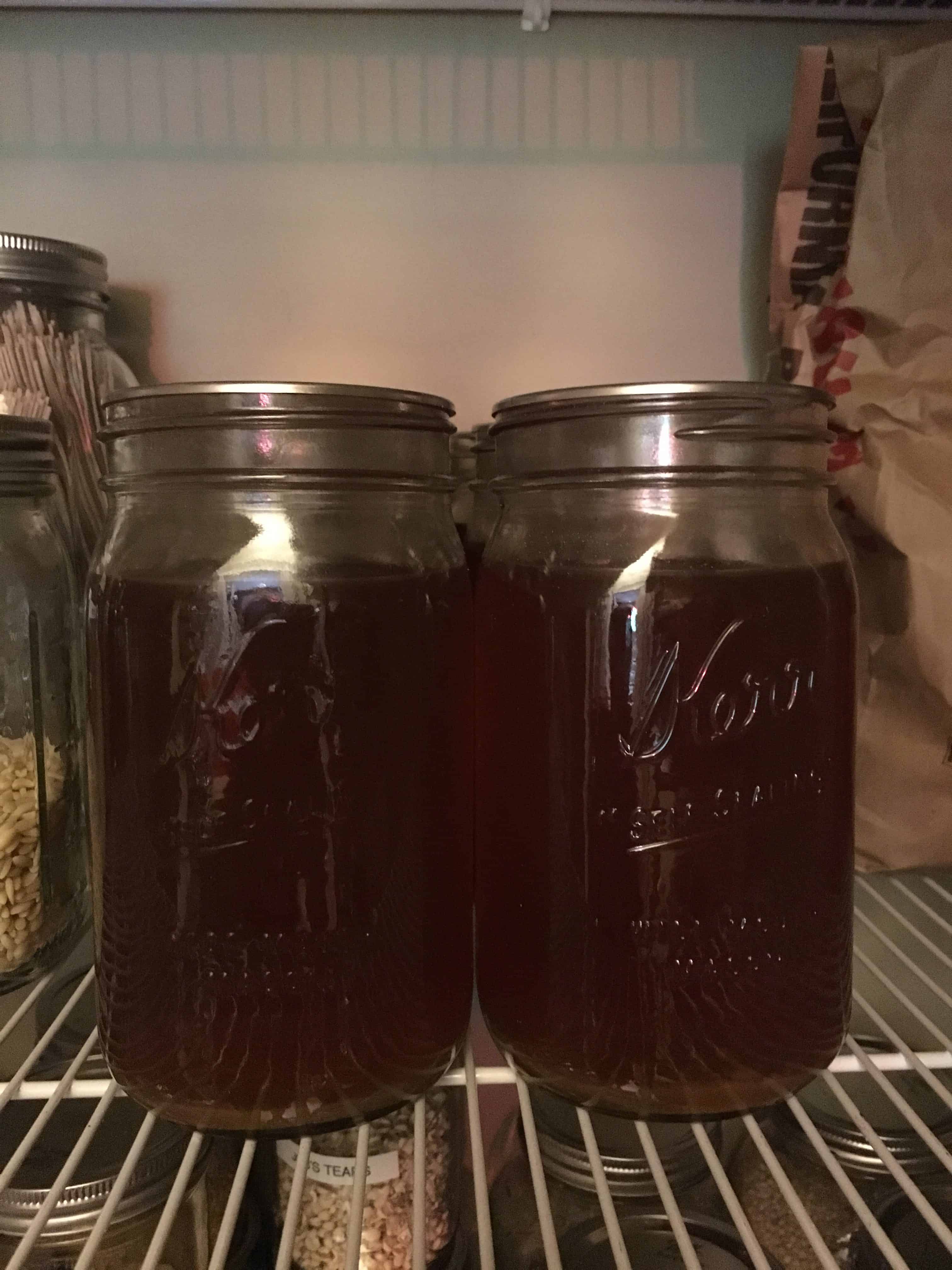 Jars of home canned vegetable broth from zero waste vegan pantry https://trimazing.com