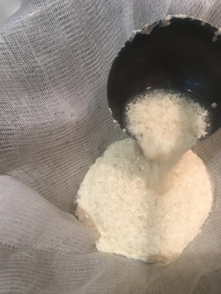 Ladling curdled soy and whey into form. https://trimazing.com/ 