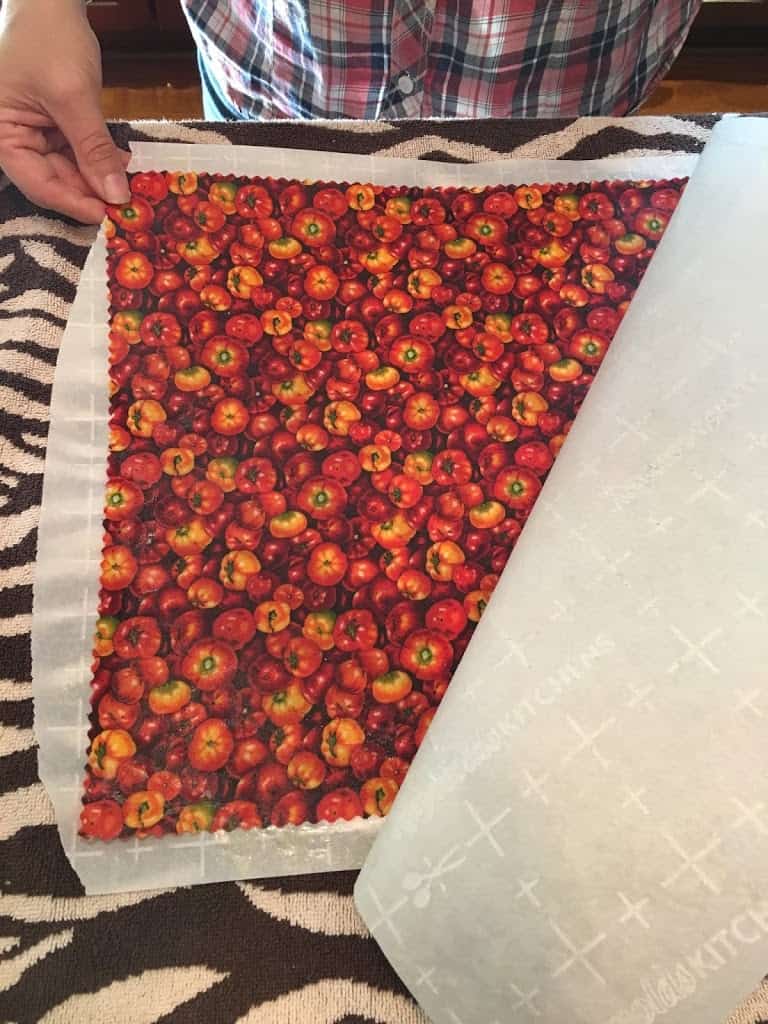 Peeling parchment paper off pressed fabric. https://trimazing.com/ 