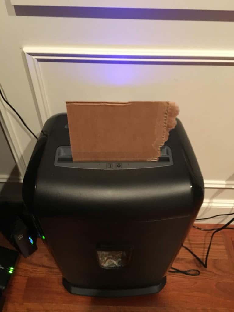 Cardboard feeding into a paper shredder. https://trimazing.com/ 