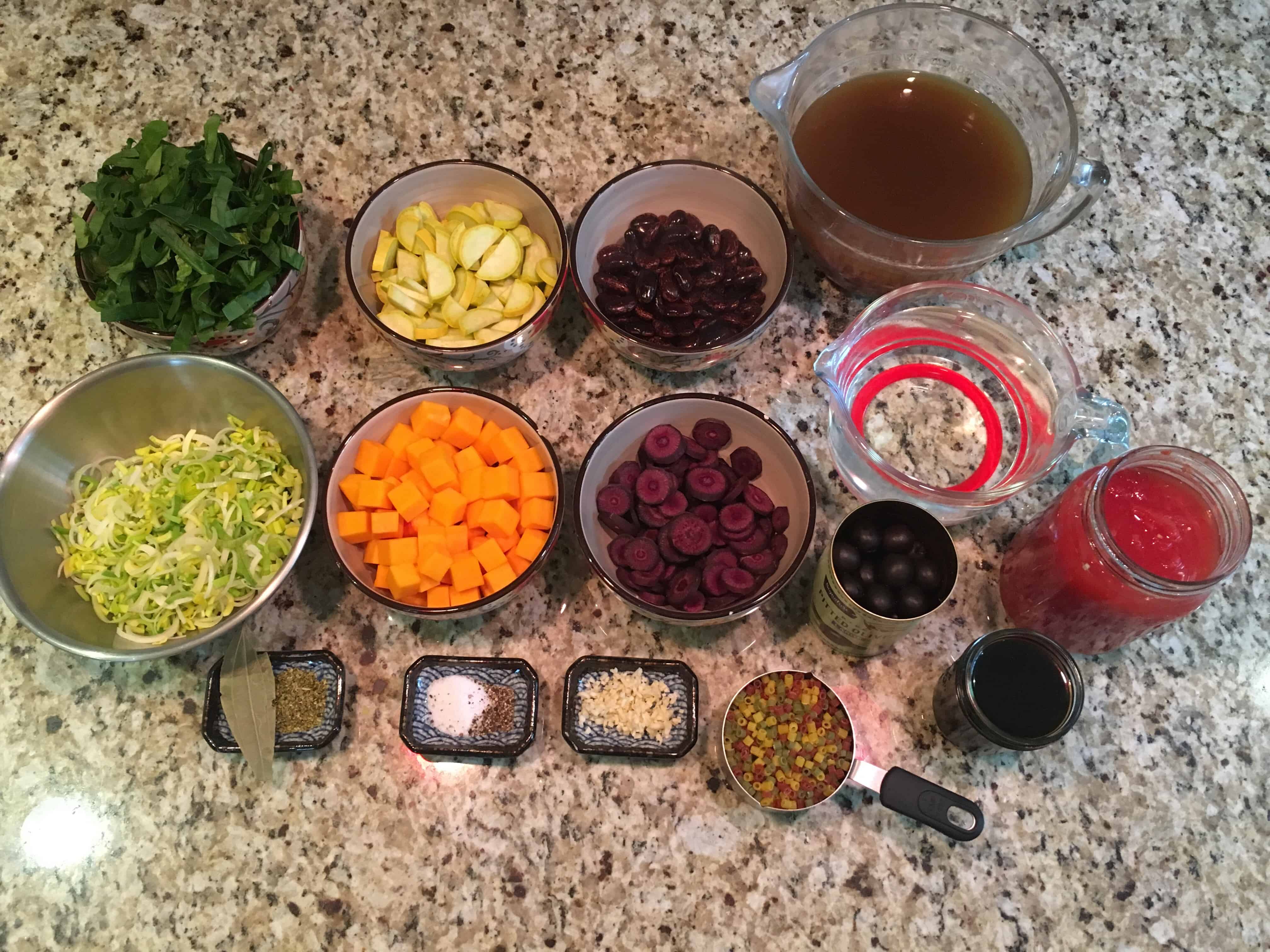 Prepped rainbow of veggies for Rainbow Minestrone Soup https://trimazing.com