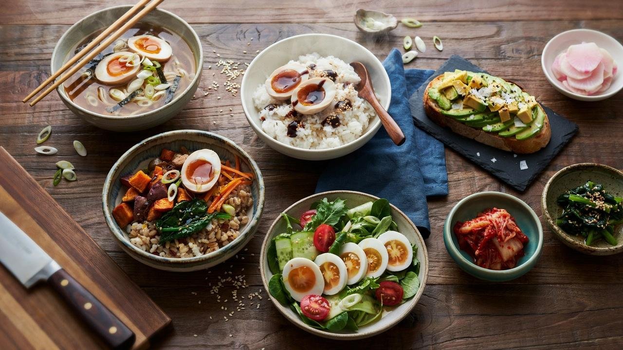 Korean drug eggs served with steamed rice, ramen, Korean side dishes, avocado toast, grain bowls, and fresh salad.