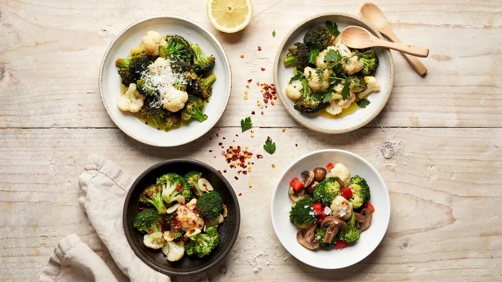 Broccoli and cauliflower cooking with garlic.