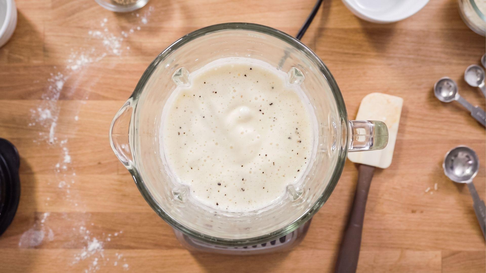 Smooth frothy egg white mixture inside a blender