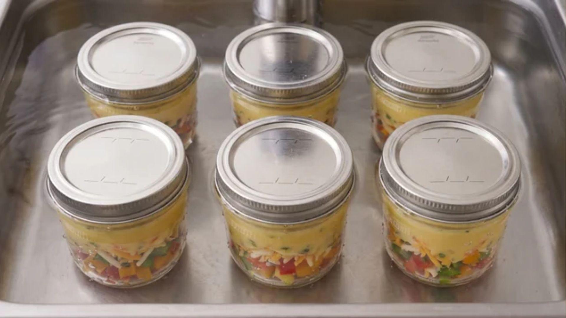 Sealed jars submerged in a sous vide water bath