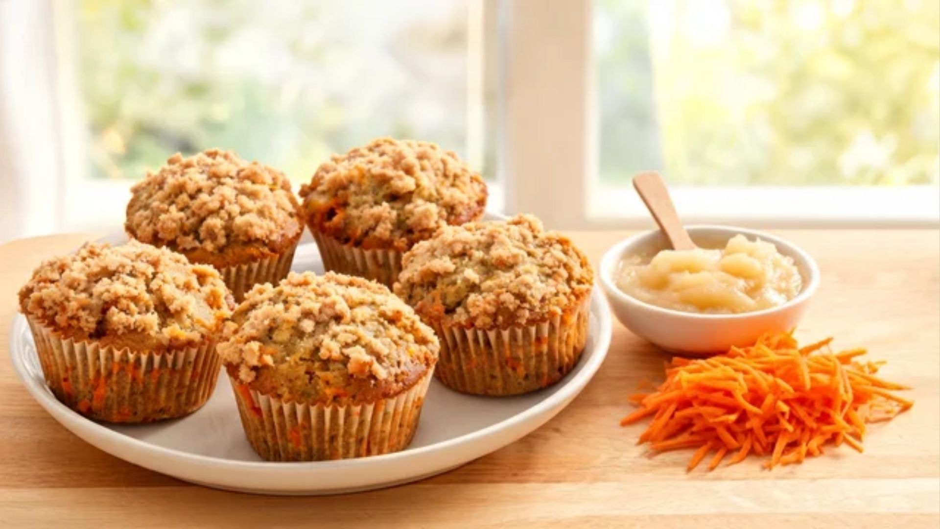 Healthy carrot cake muffins made with applesauce and topped with streusel