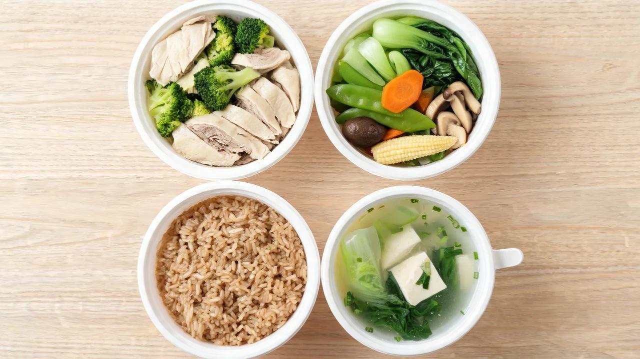 Steamed chicken with broccoli, mixed vegetables, brown rice, and Chinese soup