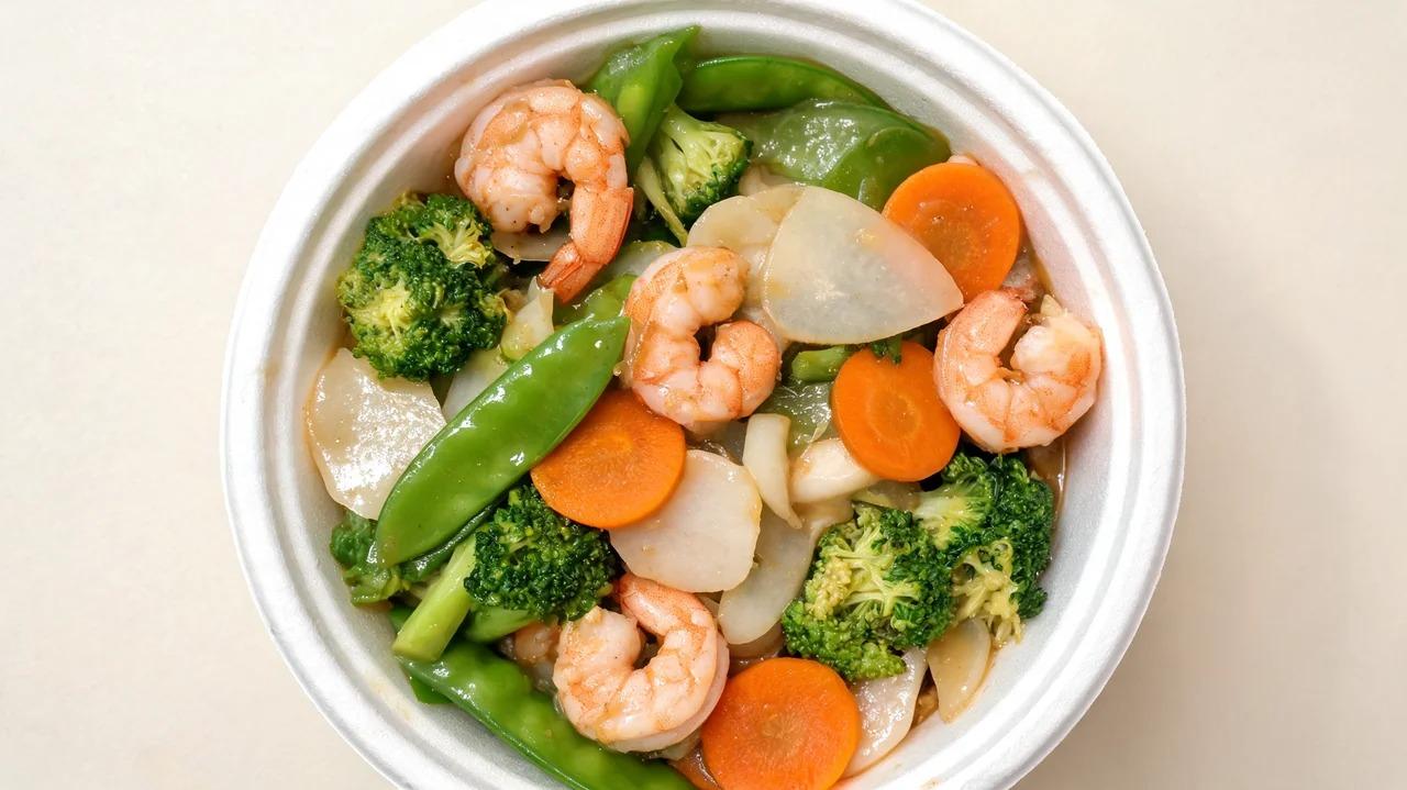 Shrimp with broccoli, snap peas, carrots, and water chestnuts