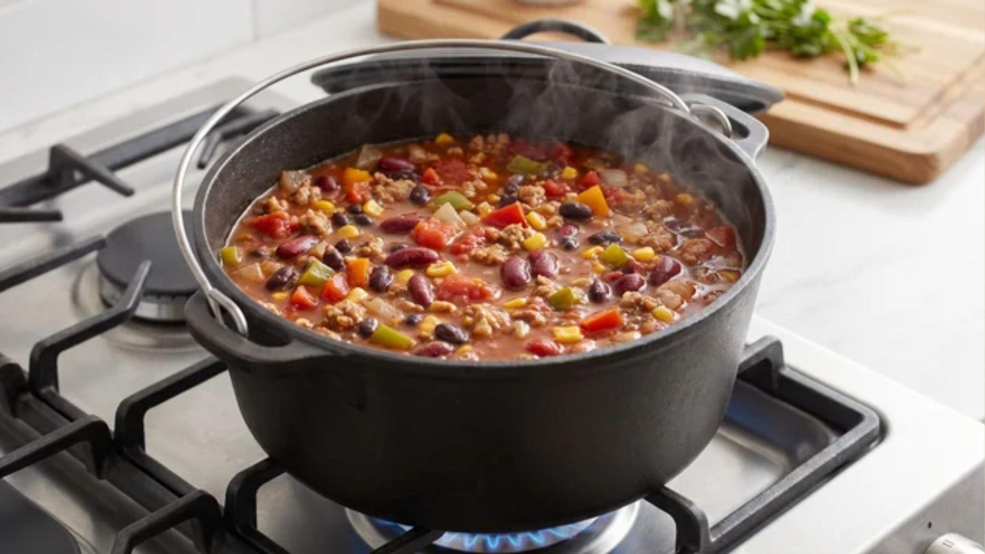 Healthy chili simmering in a Dutch oven with beans and vegetables