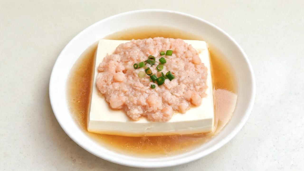 Silken tofu topped with minced shrimp in a serving dish