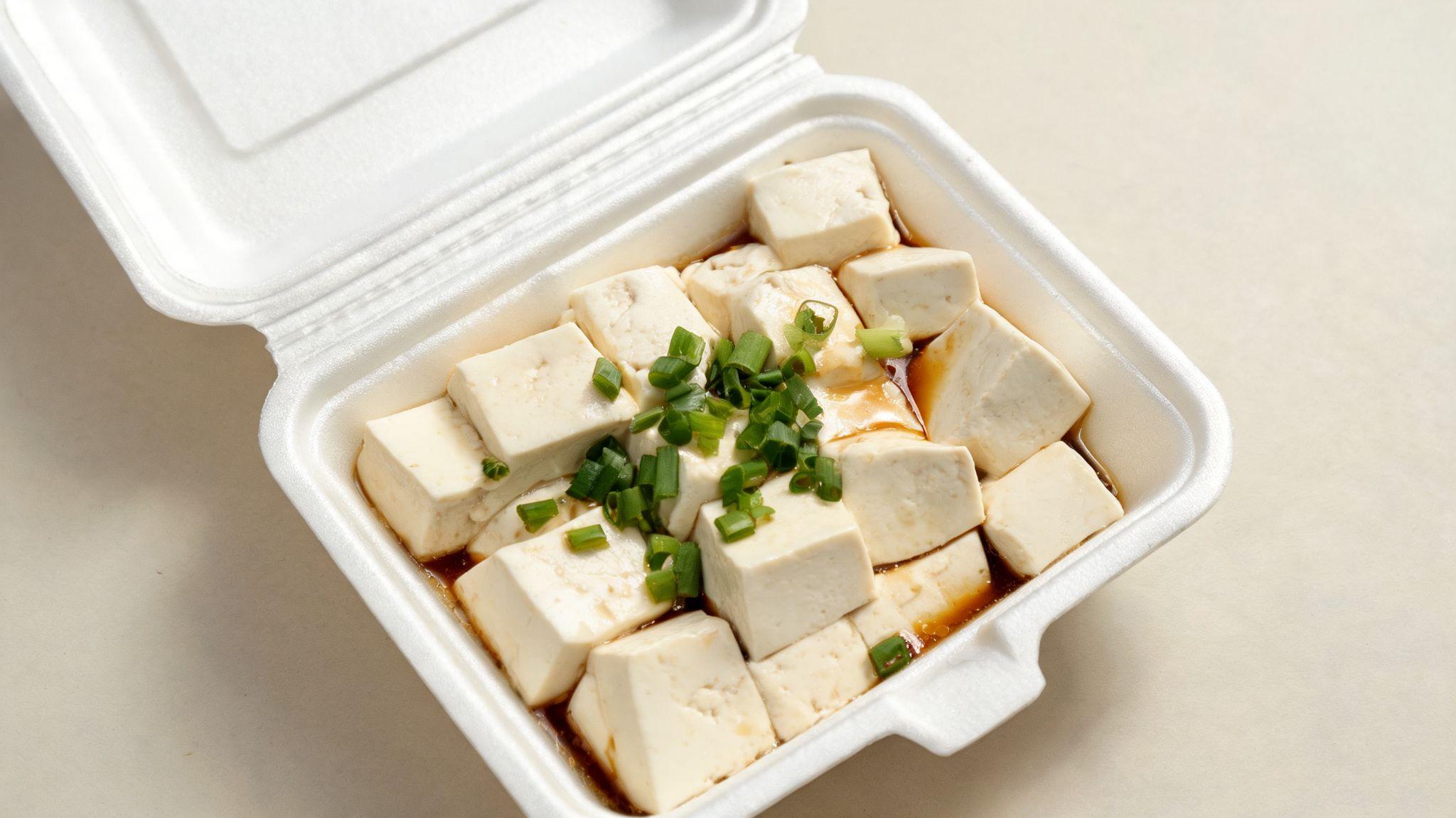 Steamed tofu served as a Chinese takeout side dish