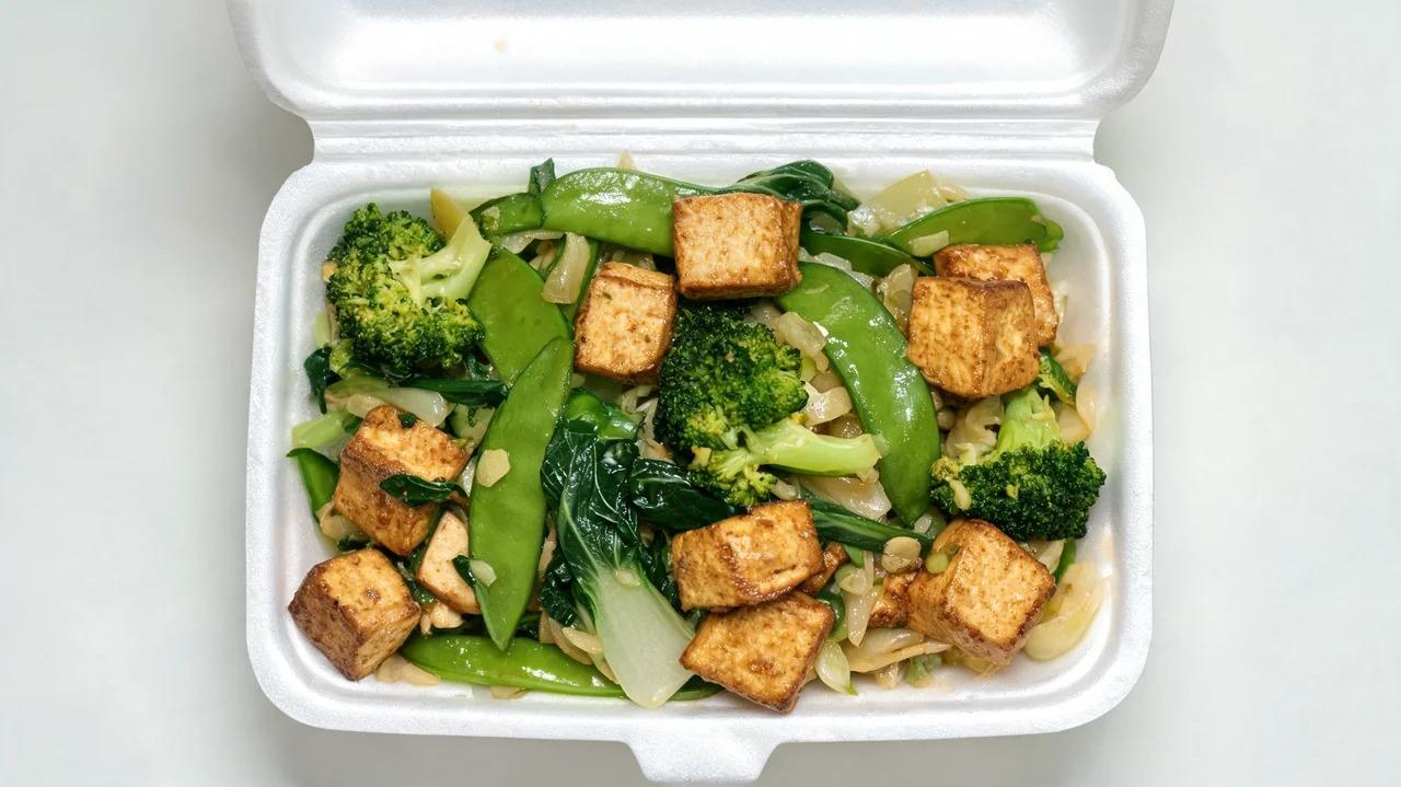 Firm tofu with vegetables in garlic or ginger sauce