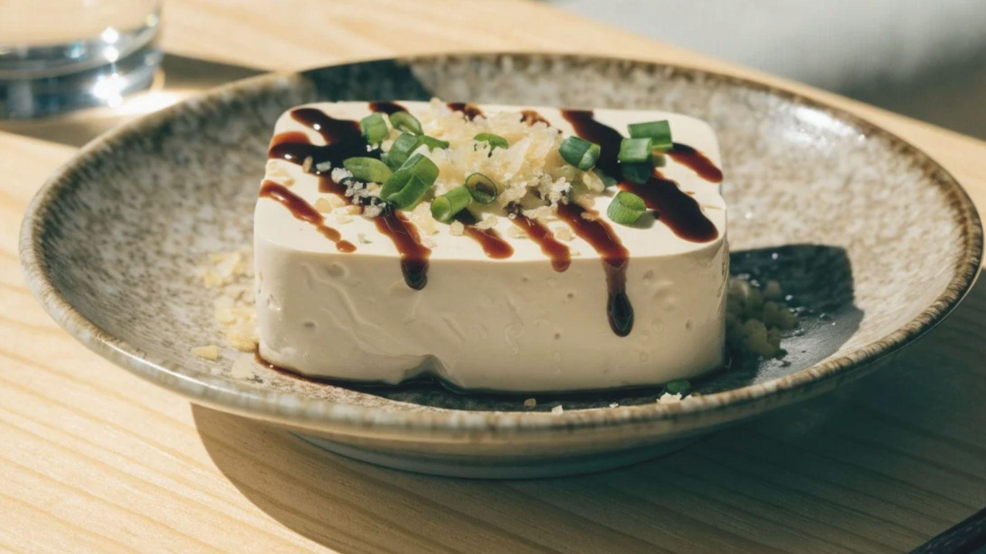 Chilled silken tofu topped with grated ginger, green onion, and soy sauce