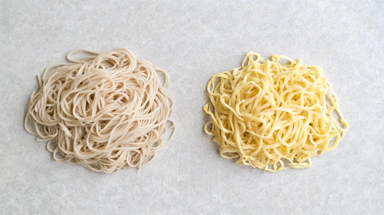Cooked wheat noodles and egg noodles displayed separately